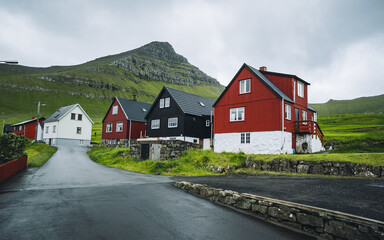Fototapeta na wymiar Colorful houses in village of Mikladalur located on the island of Kalsoy, Faroe Islands, Denmark