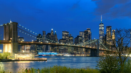 Brooklyn Bridge at night a view of lower Manhattan, New York City, USA. Long exposure.