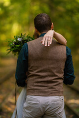 bride and groom holding hands