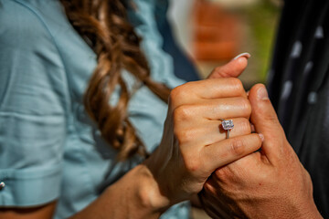 bride and groom holding hands