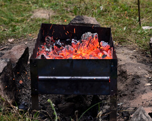 Charcoal grill with red hot coals