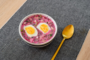 Cold beetroot soup with eggs and fresh vegetables. Popular Polish and Ukrainian meal during summer