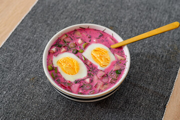 Cold beetroot soup with eggs and fresh vegetables. Popular Polish and Ukrainian meal during summer