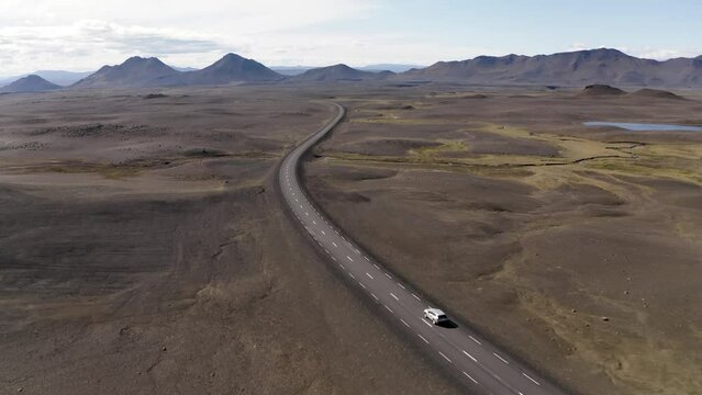 Aerial of car driving through Icelandic highlands 