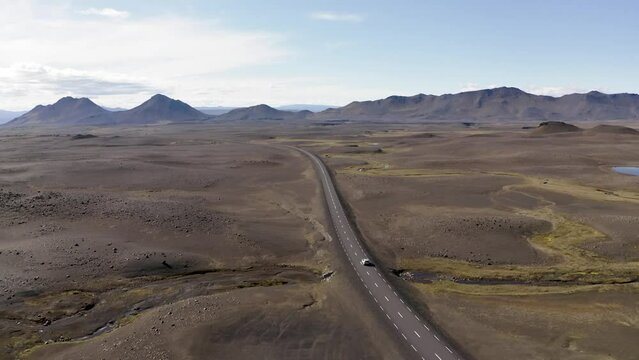 Aerial of car driving through Icelandic highlands 