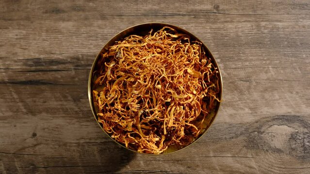 Rotating gradient in golden dish and wooden table background , video clip stock of healthy food and ingredient , healthy food content and advertising 