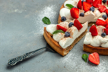piece of tasty cake pie tart with fresh strawberries, raspberries, blueberry with shovel....