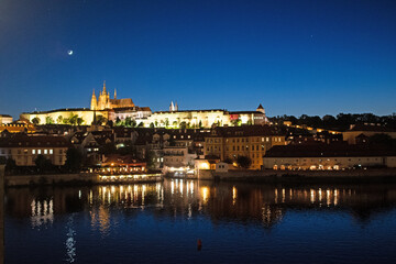 Night time view of Charles Bridge and City Castle, Prague.