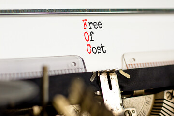 FOC free of cost symbol. Concept words FOC free of cost typed on old retro typewriter on a beautiful white background. Business and FOC free of cost concept. Copy space.