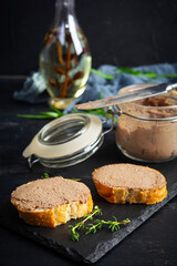 Sandwich with chicken liver pate on dark background