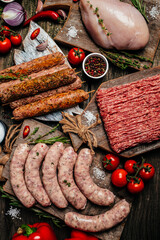 Various kinds of grill and bbq raw meats. Chicken, steak, sausages, minced beef meat kebabs, pork...