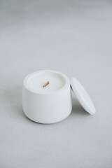 Close-up Vertical Photo of White Candle in Plaster Pot and Lid. Place for Label. Candle Handmade