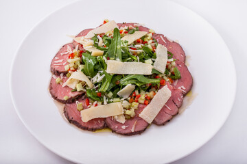 Filet mignon with parmesan and arugula