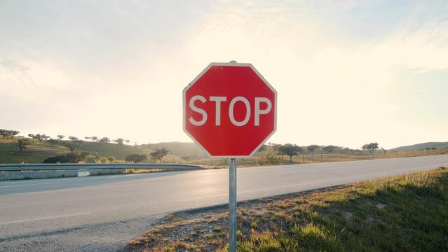 Stop sign on a empty country road. No people no cars.