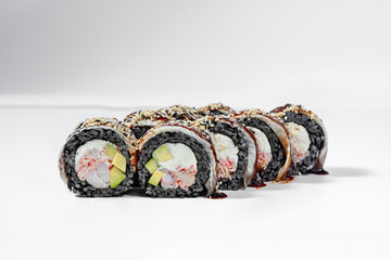Black sushi roll with crab and eel.