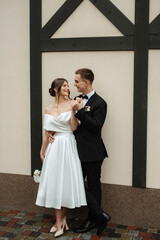 young couple bride and groom in a white short dress