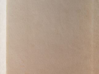 The texture of old yellowed paper. Brown textured background made of kraft paper. Paper background