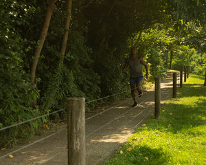 Athletic man jogging in park