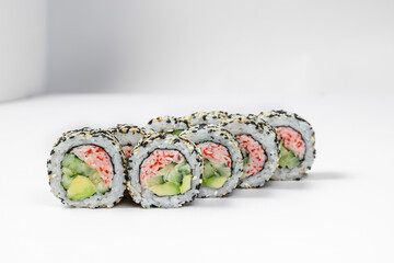 Sushi California roll in sesame with crab meat.