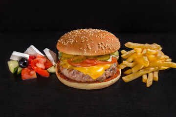 Hamburger with pork cutlet, cheese, tomato, cucumber, sauce
