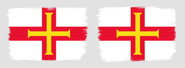 A set of two vector brush flags of Guernsey with abstract shape brush stroke effect