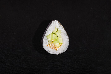 Rolls with nori, rice, cucumber and sesame seeds