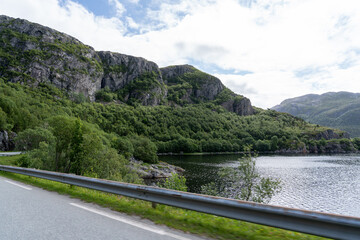 Obraz na płótnie Canvas Road along a Fjord in Norway on a sunny day 