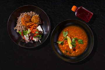 Red soup and buckwheat with meatballs