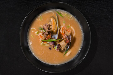 Soup with oysters, octopus, squid, shrimp and onions