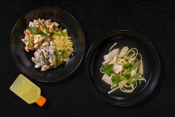 Noodles and plate of bulgur with salad