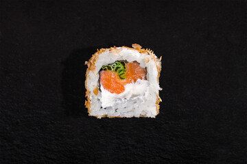 Roll with sprinkles, rice, nori, onion, salmon and cream cheese