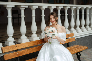 portrait of a young bride girl in a short white dress