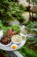 Local family cooked meal served by a restaurant near famous waterfall in Pu Luong, Vietnam                               