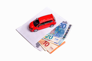 envelope with euro cash and car isolated on white, transportation cost planning concept, closeup
