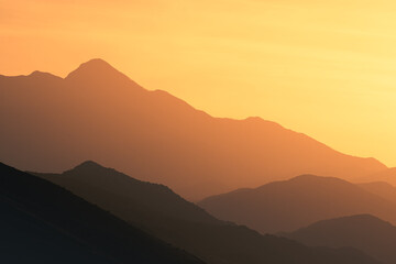 Obraz premium epic sunset above mountain layers in the alps