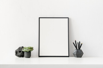 Black thin poster frame 5x7 on the table. Minimal mockup.
