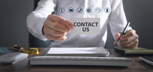 Man showing Contact Us message on paper.