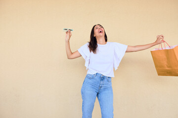 happy young woman posing in a fun way with heart shaped sunglasses 