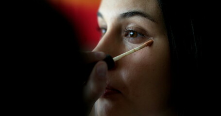Portrait woman face applying make-up