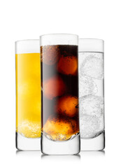 Cola soda drink with lemonade and orange soda on white background with ice and bubbles.
