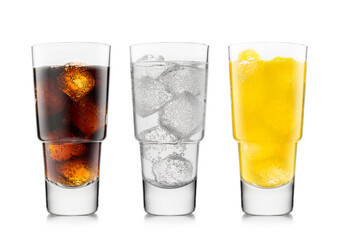 Three glasses with cola soft drink with orange soda and lemonade with ice cubes on white.