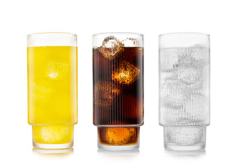 Orange soft drink with cola and lemonade soda on white background with ice cubes.