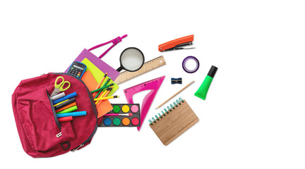 Back to school. School supplies out of a student backpack isolated on white color, top view.