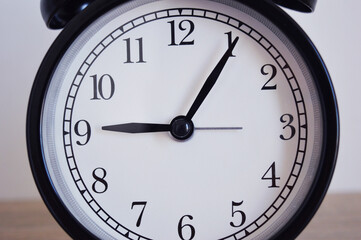Analog alarm clock pointing at hours, minutes, seconds to display time - Photo of digital timer for...