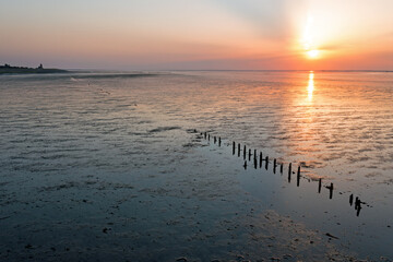 Naklejka premium Aerial from a beautiful sunset at the Wadden Sea in Friesland the Netherlands