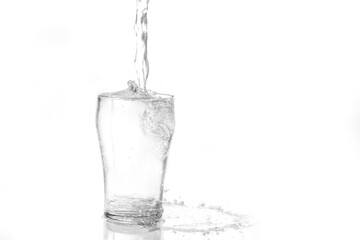 Pouring water into a glass