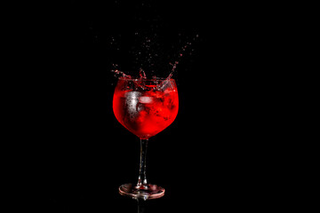 Red wine pouring into a glass