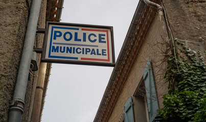 Obraz premium Municipal police station sign on the street of rural French village.