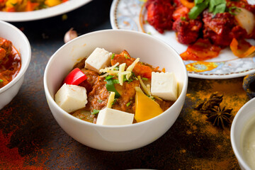 kadai chicken indian food or indian curry on dark blue table macro close up