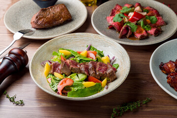Steak salad with beef, sliced roastbeef and steak from beef on plate side view